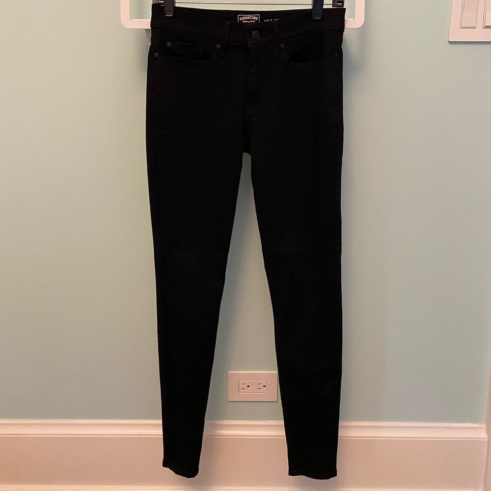 Levi’s mid rise black skinny jeans